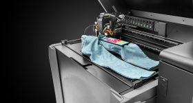 Stratasys Direct-to-Garment 3D printing process. Image via Stratasys.